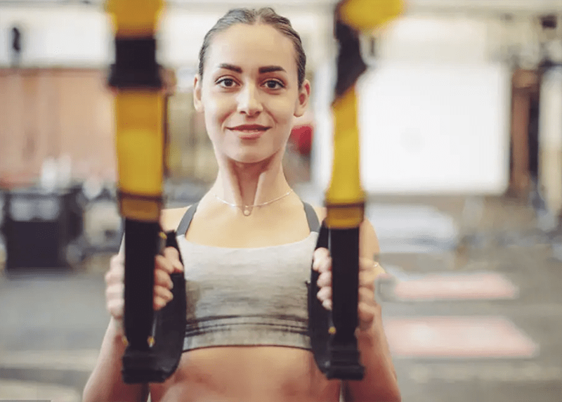 Girl is doing TRX-Training